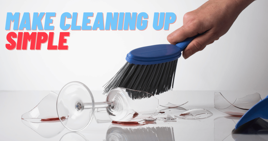 A hand sweeping broken glass shards with a brush and dustpan as shown in Maggy Maid's guide on how to clean broken glass in quick and simple steps.